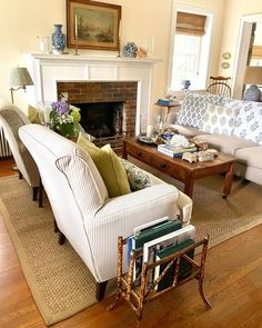 a living room filled with furniture and a fire place