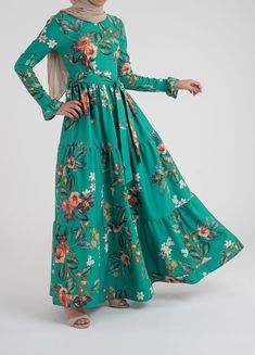 Modest Long Floral Print Dresses, Flowy Floral Print Maxi Dress With Empire Waist, Casual Floral Dress With Gathered Sleeves, Modest Fitted Floral Maxi Dress, Billowy Long Sleeve Floral Maxi Dress, Modest Flowy Maxi Dress With Empire Waist, Green Flowy Maxi Dress, Floral Print Maxi Dress With Empire Waist, Casual Dresses With Pleated Billowy Sleeves