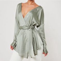 Missguided Oversized Plunge Tie Waist Blouse. Sage Green. Size Us 10 Nwt. Chic Wrap Blouse For Party, Summer V-neck Blouse For Going Out, Chic Green Wrap Top, Chic Green Wrap Blouse, Summer Party Wrap Blouse, Elegant Green Wrap Top, Spring Evening Wrap Blouse, Wrap Blouse For Night Out, Green V-neck Top For Date Night