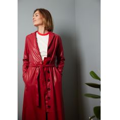 This coat is made of faux leather fabric with lapel collar. Leather Trench is equipped with hidden in seam side pockets and tied self belt in same fabric. Long sleeves with buttoned cuffs and front button closure make this an understated piece that has emphasis on both style and comfort. The product can be worn as a dress or as a coat. Made in Moldova                Artisanal               Vegan    Care: dry cleaning 100% Faux Leather Red Leather Jacket With Button Closure For Work, Red Single-breasted Leather Outerwear, Red Leather Long Coat, Red Leather Outerwear For Work, Red Belted Outerwear For Fall, Chic Red Outerwear With Double Button Closure, Red Belted Outerwear For Work, April Birthstone Jewelry, March Birthstone Jewelry