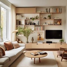 a living room filled with furniture and a flat screen tv on top of a wooden shelf