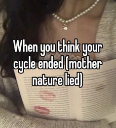 a woman reading a book with the caption when you think your cycle ended mother nature led