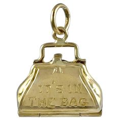 A figural 14K yellow gold pocketbook charm. Engraved "It's In The Bag" on front. Opens to reveal two lipstick cases and a perfume holder. Petite size 1/2" x 1/2." Unusual & appealing charm. Alice Kwartler has sold the finest antique diamond & gold jewelry and silver for over 40 years. Perfume Holder, Engraving Ideas, Gold Purse, Vintage Charm Bracelet, Lipstick Case, Antique Gold Jewelry, Assemblage Jewelry, Jewelry Pendants, Gold Charms