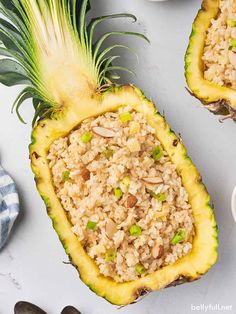 two pineapple halves with oatmeal toppings on them