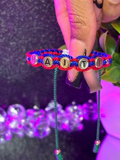 Presenting our latest accessory: the Haitian flag bracelet! With bold colors symbolizing unity, strength, and freedom, this handcrafted piece honors Haiti's vibrant culture. Wear it proudly to show your support and style. What you get: 1 Bracelet﻿ Fits size 6 1/2 in wrist and up. If you need to 8 in wrist and up please leave a note in the special note box. Patriotic Multicolor Friendship Bracelets, Customized Adjustable Red Wristband, Patriotic Multicolor Friendship Jewelry, Adjustable Patriotic Friendship Bracelets As Gifts, Handmade Adjustable Patriotic Bracelets, Handmade Adjustable Patriotic Bracelet, Patriotic Handmade Adjustable Bracelets, Handmade Patriotic Bracelets For Gift, Patriotic Multicolor Bracelet Jewelry