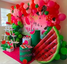 a watermelon themed birthday party with balloons