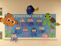 a bulletin board with fish and sea animals on it's sides, hanging from the wall