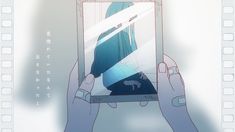 someone is holding up a phone with an image on it