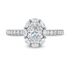 an oval cut diamond ring with pave set shoulders