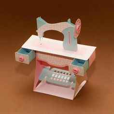 a toy sewing machine sitting on top of a table