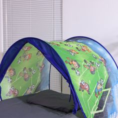 a child's tent with cartoon characters on it