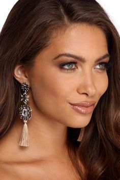 You'll for sure make a statement in these stunning gemstone tassel earrings! They feature a round rhinestone encrusted stud attached to a flower shaped piece adorned with faceted gemstones and rhinestones. They lead to a large faceted gemstone surrounded by smaller gemstones and rhinestones. creating a beautiful design. A single tassel hangs off the end of the earrings. These cascading beauties feature post back closures. Sequin Top Dress, Rhinestone Dress, Discount Jewelry, Glitter Dress, Dress Jewelry, Earrings Statement, Faceted Gemstones, Dress And Heels, Flower Shape