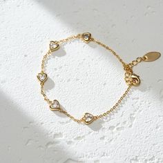 The Lots of Love Bracelet is a heartfelt ode to affection and warmth. Crafted from 18K gold plated brass, this piece is a tangible representation of love's enduring bond. It's a reminder that love comes in many forms, each one precious and worth cherishing. Wear it as a symbol of the love you give and the love you receive, a circle of joy that envelops your wrist. PRODUCT DETAILS Materials: 18K Gold Plated, 316L Stainless Steel Bracelet Length: 6.7 - 8 inch / 17-20.5 cm Includes bracelet Adjustable Silver Heart Bracelet Gold Plated, Adjustable Tarnish-resistant Heart Bracelet Gift, Promise Bracelet In Gold-toned Stainless Steel, Gold Stainless Steel Promise Bracelet, Adjustable Gold-plated Bracelet For Anniversary, Adjustable Gold Plated Bracelet For Anniversary, Yellow Gold Brass Charm Bracelet Gift, Tarnish Resistant Heart Bracelet For Anniversary, Gold Metal Heart Bracelet For Wedding