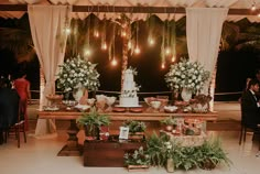 a table filled with lots of food and flowers