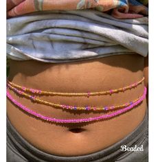 This set is comes with 3 waist beads  1 pink  1 pink, purple, gold  1 pink and gold   --- if no waist size is listed then waist bead  will default to 50 inches **If you add a clasp Please include your Waist Size . If your waist size is not listed, send me a message. This shop accepts all sizes. If don't know your waist size please choose tie on method and you can adjust it when get it to your custom size .  handmade with love  Free affirmation cards with your order  ️⚖️ Cheap Bohemian Waist Beads For Women, Adjustable Waist Chain For Beach And Summer, Bohemian Waist Chain With Colorful Beads For The Beach, Bohemian Waist Beads For Beach, Bohemian Waist Chain For Summer Beach, Bohemian Colorful Waist Beads For The Beach, Bohemian Waist Chain For Beach In Summer, Bohemian Style Colorful Waist Beads, Beach Waist Beads With Tiny Beads