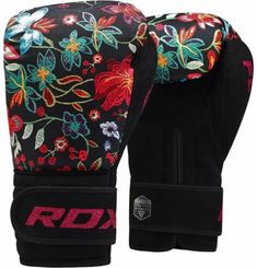 a pair of black boxing gloves with colorful flowers on the front and back of it