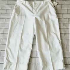 New W/ Tags! Vintage 90s/00s! Super Cute, Wide Leg, Loosefit Crop (Capri) High Rise Pants By Studio Works! Bleach White Airy Woven Polyester/Cotton Blend Fabric. Pockets With Button/Zip Closure. Tag Size 16, But Please Compare Measurements To A Similar Piece For Best Fit! Measurements (Approx. Laying Flat)- Waist- 17" Rise- 12 1/2" Inseam- 22" Spring Mid-rise Cotton Capris, White Mid-rise Capris For Summer, White Stretch Cotton Capris, White Fitted Short Pants, Fitted White Short Pants, White Relaxed Fit Cropped Capris, White Fitted Cotton Bottoms, Fitted Wide-leg Summer Capris, Fitted White Cotton Bottoms