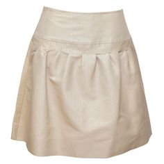 GUARANTEED AUTHENTIC VALENTINO BEIGE A-LINE PLEATED SKIRT Details: - Timeless A-line silk skirt in a khaki beige color. - Yoke waist. - Pleating. - Side zipper closure. - Unlined. Material: 80% Cotton, 20% Silk Size: 4 Measurements (Approximate laid flat, Alterations By Chanel): - Waist, 14.25" (higher waisted) - Hip, 18" - Total Length, 19" (tip of front waistline to bottom front hem) To Our Customers: - We consider it a privilege to serve as your luxury fashion concierge. Whether you are looki