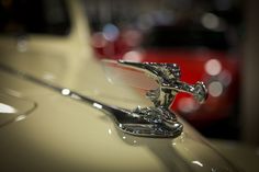 the hood ornament on an antique car