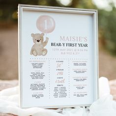 a baby's first year sign with a teddy bear