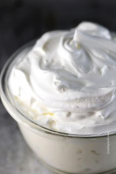 whipped cream in a glass bowl on a table