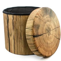 a round wooden container with black lining around it