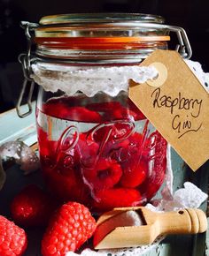 raspberry jam in a jar with fresh raspberries