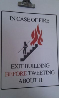 a sign that says in case of fire exit building before tweeting about it