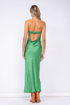 Go to your next formal event wearing the Marla Green Floral Satin Strapless Maxi Dress! Green floral satin fabric shapes this maxi dress with a strapless neckline and an open back. Features a ruched elastic strap in the back - style with your favorite heels and jewelry for a chic formal look! DETAILS & FIT S: 50" Length, " 29 Bust, 28" Waist, 34" Hips M: 51.5" Length, 30" Bust, 30" Waist, 36" Hips L: 52" Length, 31" Bust, 32" Waist, 38" Hips 55% Viscose, 45% Rayon. Machine wash cold. Imported. Satin Maxi Dress With Ruched Back, Glamorous Satin Maxi Dress With Ruched Bodice, Glamorous Ruched Satin Maxi Dress, Satin Maxi Dress With Ruched Back For Gala, Evening Ruched Satin Backless Dress, Satin Floor-length Maxi Dress With Ruched Back, Strapless Satin Halter Dress, Backless Satin Maxi Dress For Gala, Backless Satin Maxi Dress For Prom Season