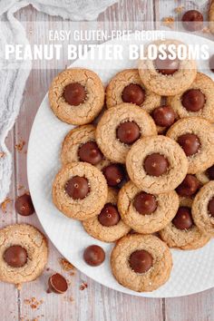 peanut butter blossoms on a plate with chocolate chips