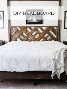 a bed with white sheets and wooden headboard