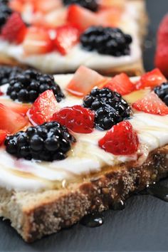 a close up of a pizza with berries on it