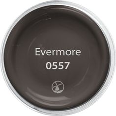 the black licorce logo is shown in white on a dark gray bowl with silver rim