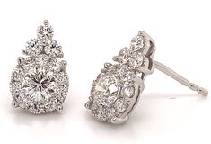 This design is so elegant. She will never take these off her ears. Boasting 1.47ctw of diamonds these earrings have a flower motif that makes them so unique and beautiful.Metal: 18kt White GoldDiamond Weight: Center (2) 0.76, (260 0.71ctw Totaling 1.47ctwDiamond Shapes: RoundsMeasurements: W13mm x L9mmBacking: Push Back Formal Diamond Earrings With Flower Shape, Diamond Flower Shaped Earrings For Formal Events, Diamond Flower Shaped Earrings For Formal Occasions, Elegant Diamond Cluster Earrings Gia Certified, Elegant Gia Certified Diamond Cluster Earrings, Luxury Diamond Bridal Earrings In Flower Shape, Luxury Diamond Flower-shaped Bridal Earrings, Luxury Diamond Bridal Earrings With Flower Shape, Dazzling Flower Shaped Diamond Earrings For Formal Occasions