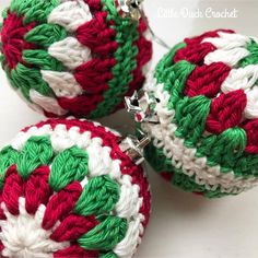 three crocheted christmas ornaments are shown on a white surface with green, red and white trim