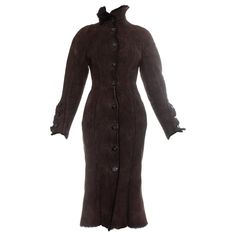 Vivienne Westwood brown shearling coat dress. High neck, signature Westwood Orb buttons, fitted waist and flared skirt. Fall-Winter 1992 Harris Tweed Jacket, Wool Waistcoat, Dress High Neck, Designer Coats, Winter Chic, Shearling Coat, Coat Design, Vintage Coat, Classic Dress