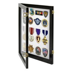 a display case with many different badges and insignias on the front, in black frame