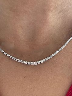 LEGANT ENDLESS DIAMOND TENNIS NECKLACE. GRACEFUL ROW OF GRADUATED DIAMONDS WORN FOR ANY OCCASION OR WITH ANY JEWELRY. OUR UNIQUE 4 PRONG GRADUATED DIAMOND DESIGN GRACEFULLY DRAPES AROUND THE NECK. SITS PERFECTLY WITH OTHER NECKLACES, PENDANTS OR CHAINS. 14KT WHITE GOLD or YELLOW GOLD 16" LONG. Available in any length. (Contact us for custom length Pricing) 4.00 CARATS TOTAL WEIGHT WITH OVER 235 MATCHED GRADUATED NATURAL DIAMONDS OF EXCEPTIONAL QUALITY. I/J Color, SI2/I clarity. (Exact Number and Diamond Tennis Necklace, Box Clasp, Tennis Necklace, Diamond Design, Necklace Length, Diamond Studs, Round Diamonds, Natural Diamonds, Necklace Lengths