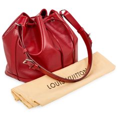 The Noe bucket bag is crafted from Louis Vuitton's signature Epi leather and silver hardware, and features an open top with a drawstring for easy access. The inside features a large compartment lined in faux suede for a luxurious feel. SPL Exterior Red Epi leather Silver hardware Drawstring closure One detachable and adjustable shoulder strap TJ3153 - date code Great condition - some scratches to base and light creasing around the bag. Interior Red faux suede interior Spacious interior One zip pocket Louis Vuitton embossed logo Excellent condition - light signs of wear but well kept Dust bag included SPL Height 26cm Width 25cm Depth 20cm Dior Shoes, Leather Silver, Diaper Backpack, Bags Designer Fashion, Exclusive Bag, Open Top, Casual Backpack, Embossed Logo, Chanel Handbags