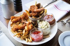 a plate with fries, ketchup and other condiments on it that says 5 great places to eat in rehoboth beach