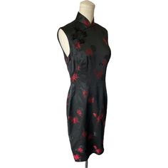 Vintage Black And Red Cheongsam Qipao Traditional Look Dress No Tags Or Labels, Unsure If Fabric Is Silk Or Not, Fully Lined Black With Chinese Symbols And Red Flowers, Mandarin Collar Side Ykk Metal Zipper, Frog Closures And Snaps Vintage Pre-Owned Condition, No Major Flaws Observed, May Have Small Fabric Imperfections, See Photos. No Labels Or Size Tags, See Measurements For Sizing. Flat Measurements: Bust 16.5 In. Waist 14.5 In. Hip 19.25 In. Total Length 39 In. Remember, Vintage Sizing May Run Smaller Or Larger Than Current/Modern Sizing, So Please Check Measurements Before Purchasing To Ensure Accurate Fit! Items That Are Vintage Or Pre-Owned May Have Signs Of Gentle Use Or Wear Black Fitted Cheongsam For Formal Occasions, Formal Embroidered Fitted Cheongsam, Black Qipao, Fitted Black Cheongsam For Evening, Formal Black Fitted Cheongsam, Black Fitted Formal Cheongsam, Red Sleeveless Fitted Cheongsam, Traditional Fitted Sleeveless Cheongsam, Elegant Red Sleeveless Cheongsam