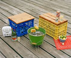 several different colored containers on a wooden deck