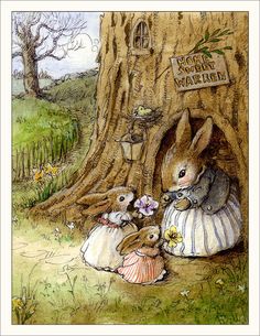 two rabbits are sitting in front of a tree