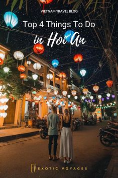 two people walking down the street with lanterns in the air and text top 4 things to do at hoi an