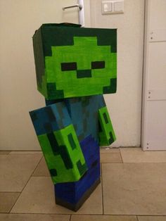 an image of a minecraft creeper made out of paper machs on the floor