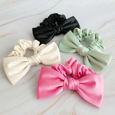 Satin Bow Tie Hair Scrunch Enhance your hairdo with this exquisite satin hair scrunchie featuring a charming bow tie detail. Crafted from high-quality materials, this accessory is designed to add a touch of sophistication to any hairstyle. Perfect for both casual outings and formal occasions, this versatile hair scrunchie is a must-have accessory in your collection. The dimensions of this scrunchie are approximately 5.5" x 3" x 1", ensuring a comfortable fit for various hair types. Key Features: High-quality satin material Chic bow tie detail Suitable for both casual and formal events Bow Tie Hair, Diy Hair Scrunchies, Tie Hair, Hair Setting, Satin Bow, Dress Jewelry, Satin Material, Scrunchie Hairstyles, Hair Accessories Headbands