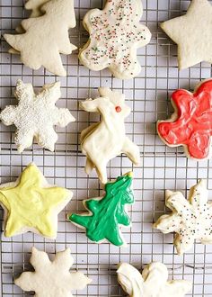 several decorated cookies on a cooling rack