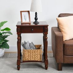 a living room with a couch, chair and end table