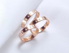 ♦ This is a PREORDER which ships out in 1-3 weeks ♦ 4mm x 1mm thick, 14K Rose gold band an everyday stacking ring, or minimal wedding band ⟡ Engravings are 1.5mm tall ♦♦ Personalized jewelry are FINAL SALE ♦♦  Please double check your U.S. ring size to ensure correct fit. Wider rings feel tighter than thinner rings/ring sizers. // This style can be customized // Width: 2 - 10mm Thickness: 0.75mm - 1.5mm Metal: 14k Yellow Gold, 18k Yellow Gold, 10K Yellow Gold, 14K Rose Gold, 18K Rose Gold, 14K W Minimal Wedding Band, Wedding Band Engraving, Clean Sterling Silver, Engraved Ring, Tarnished Jewelry, Solid Gold Band, Ring Wedding Band, Forever Jewelry, Gold Engraving