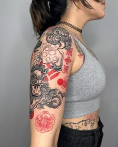 a woman with a tattoo on her arm